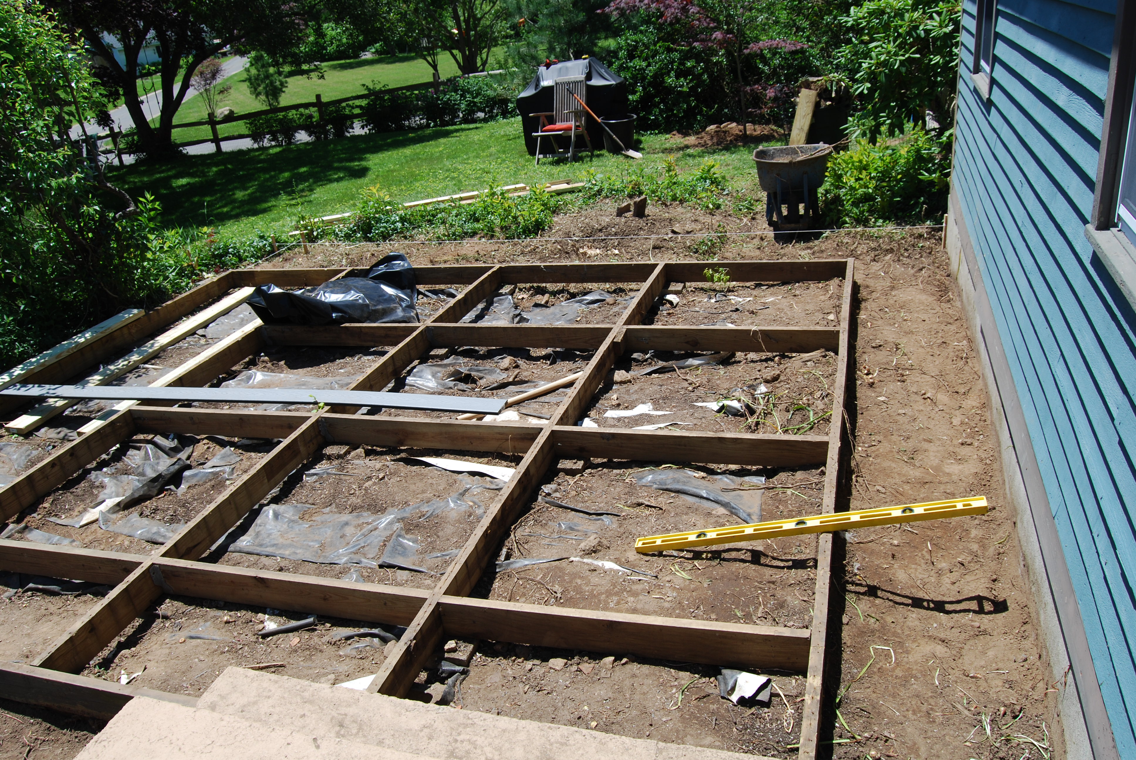 The deck on the original house, was tiny, floating and had a bunch of rotted boards. I sadly don't have a photo of it with the decking still on.