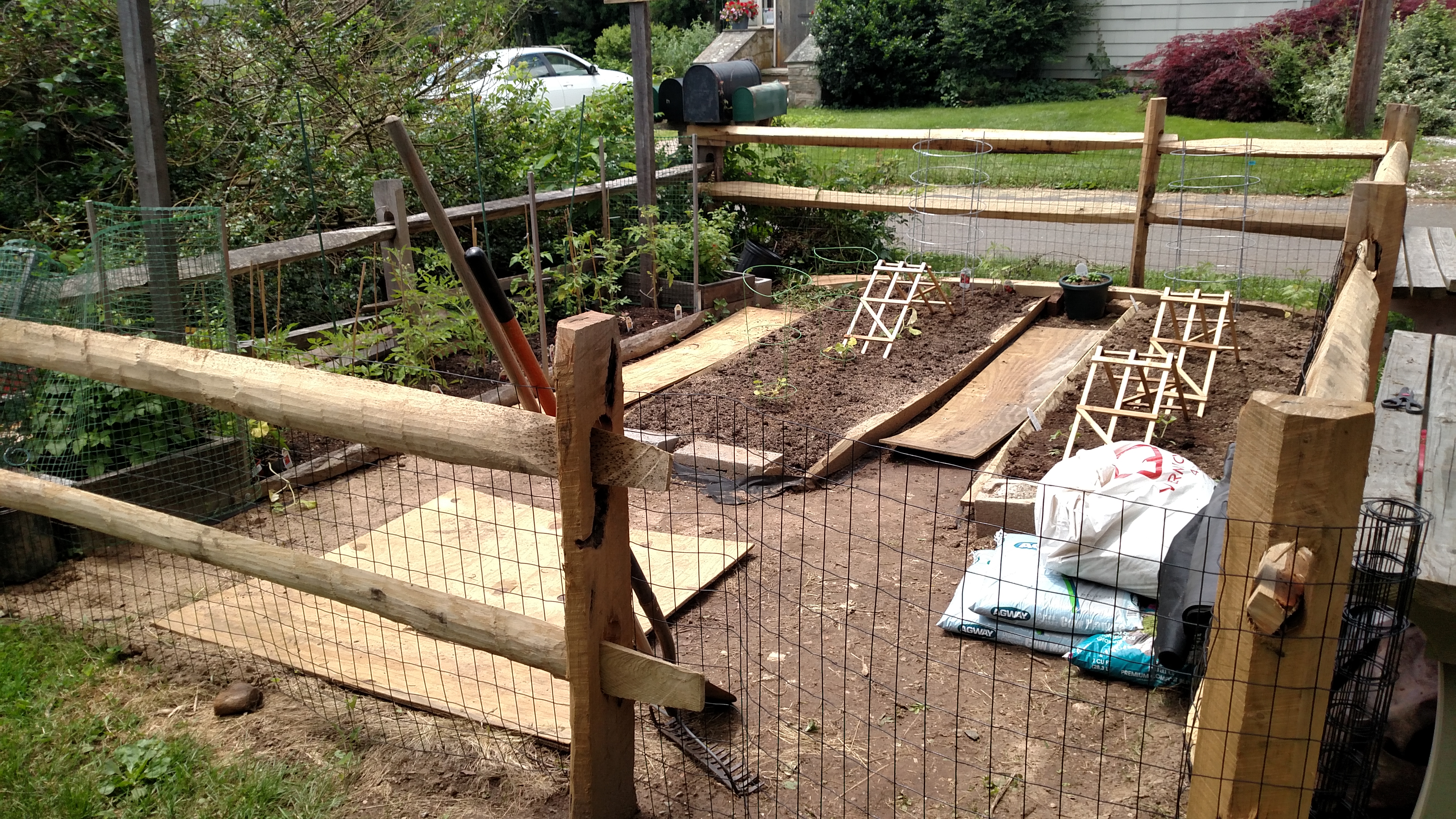 My mom wanted a larger garden, so we got some split-rail fencing and added this to the front yard.